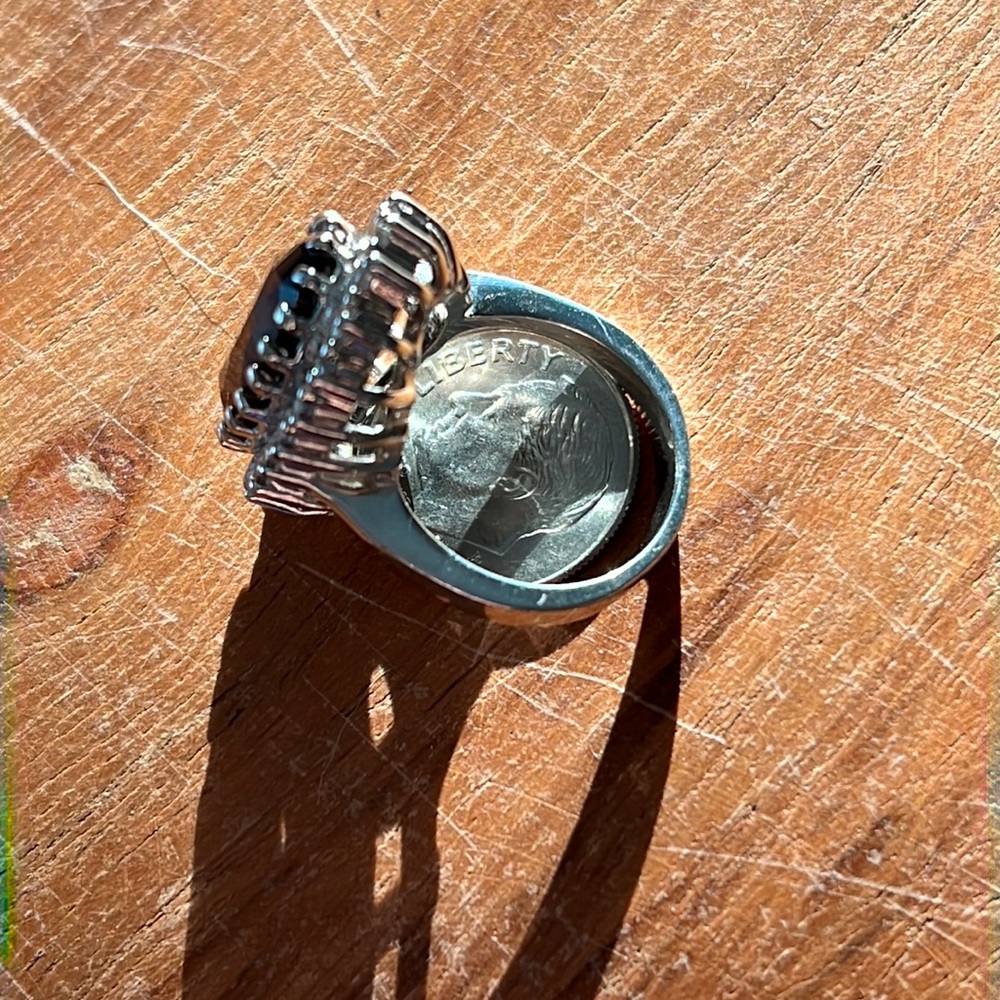 ring is a stainless steal Onyx stone with cubic zirconia stones.